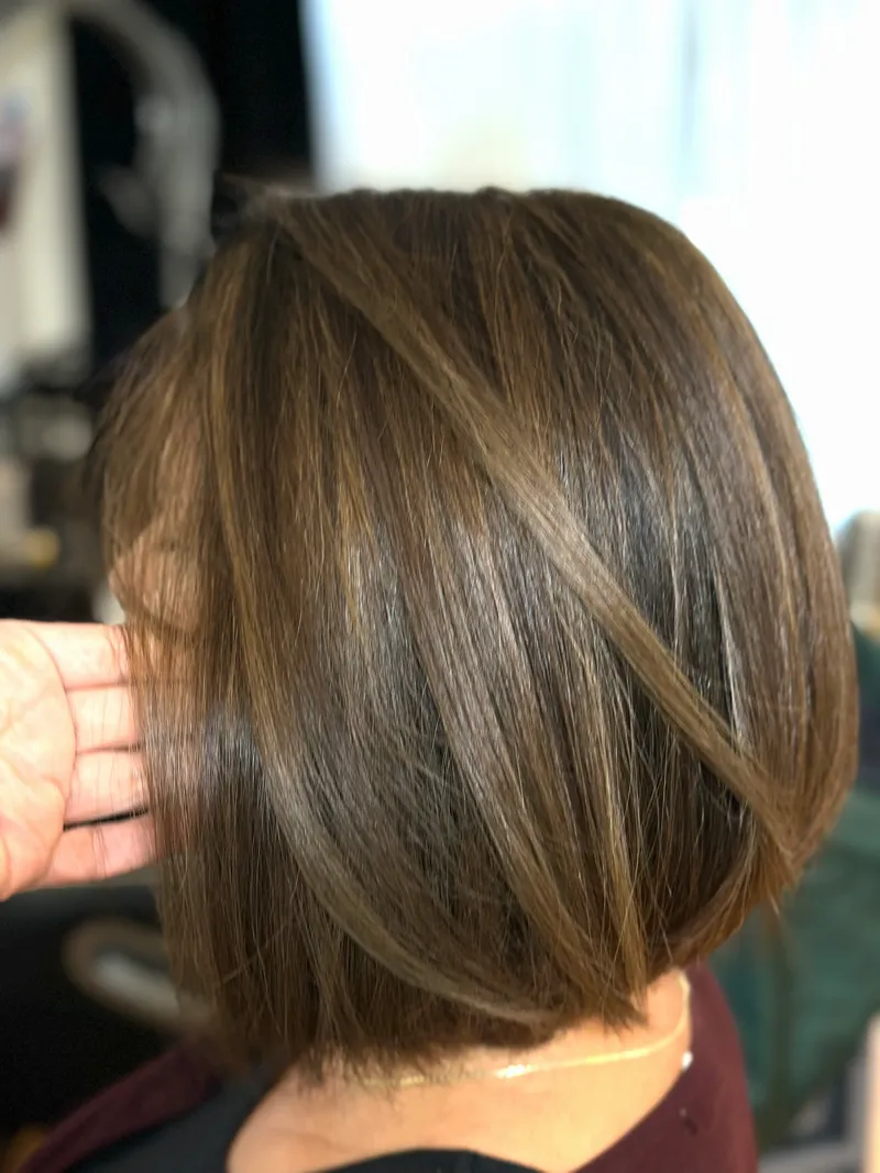 Layered women’s haircut result at Elika Beauty